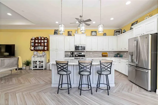 a living room with lots of furniture and a large window
