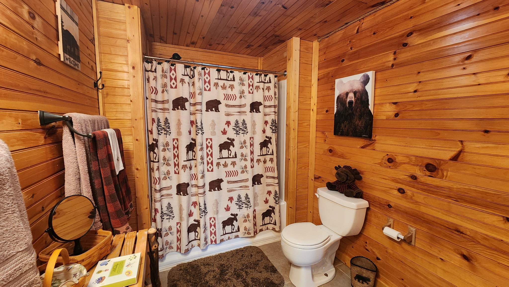 5615 Eastport Road Alpine, TN 38543 - Photo 17 of 83 a bathroom with a toilet and shower curtain