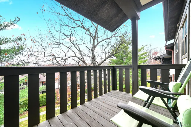 a view of a two chairs on the roof deck