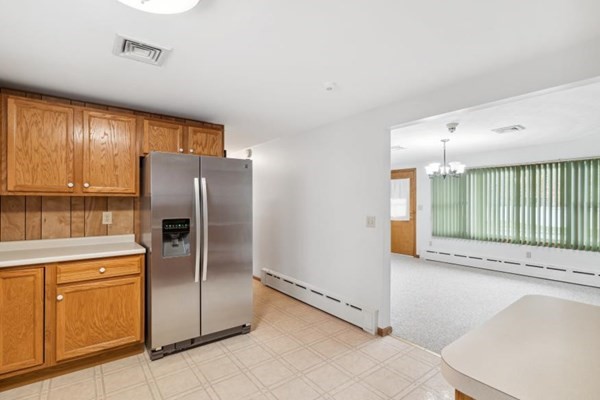 189 Brook Street Clinton, MA 01510 - Photo 11 of 29 a kitchen with stainless steel appliances a refrigerator and microwave