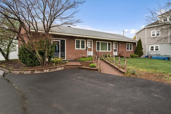 189 Brook Street Clinton, MA 01510 - Photo 2 of 29 a view of a house with a big yard and large tree