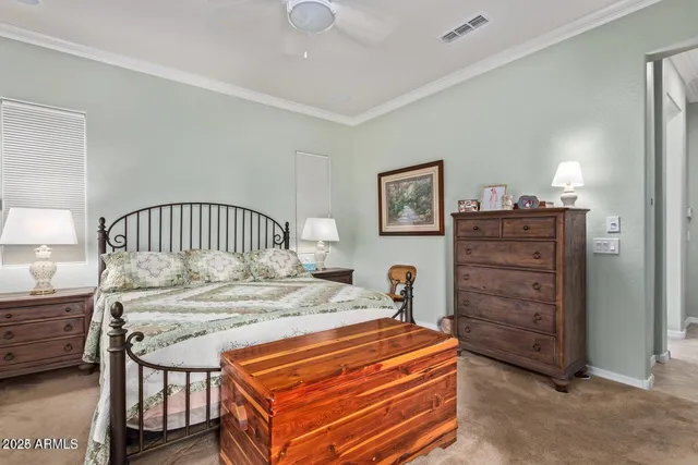 a bedroom with a bed and a dresser