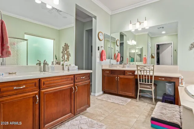 a spacious bathroom with a sink a vanity and a mirror
