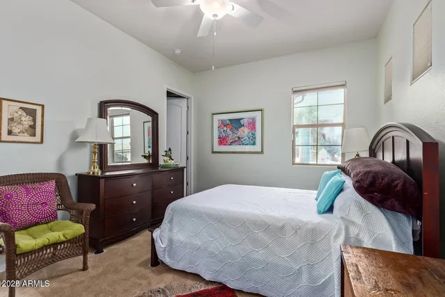 a bedroom with a bed and a dresser