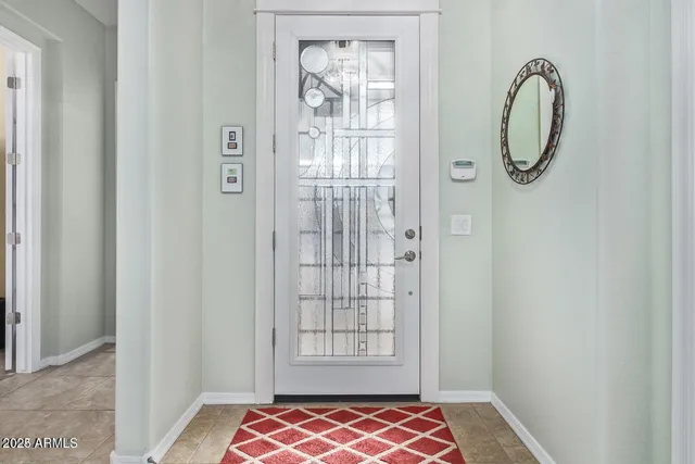 a door with wooden floor and a shower