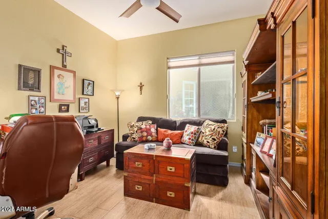 a bedroom with furniture and a window