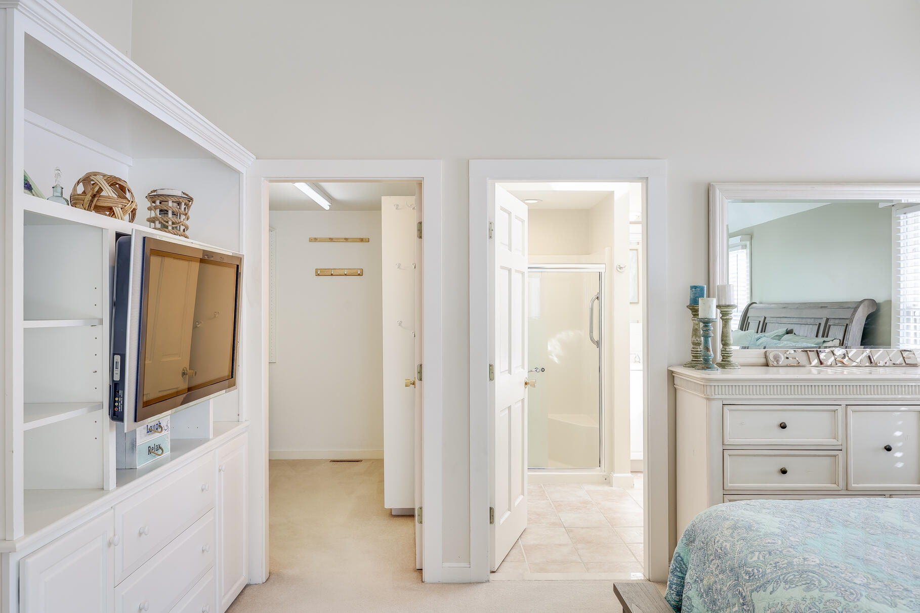 156 Commerce Road Barnstable, MA 02630 - Photo 24 of 54 a spacious bedroom with a bed and a flat screen tv