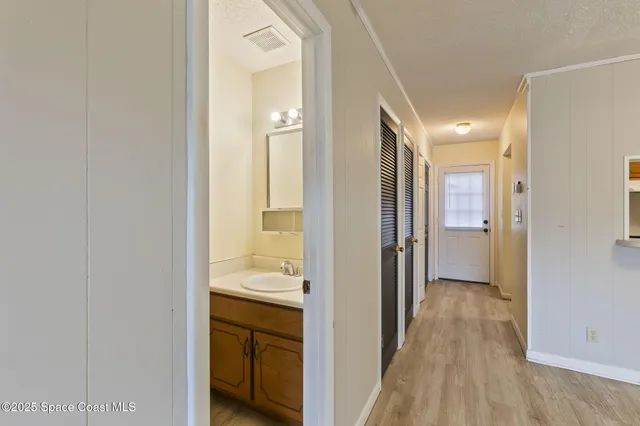 a view of a bathroom from a hallway