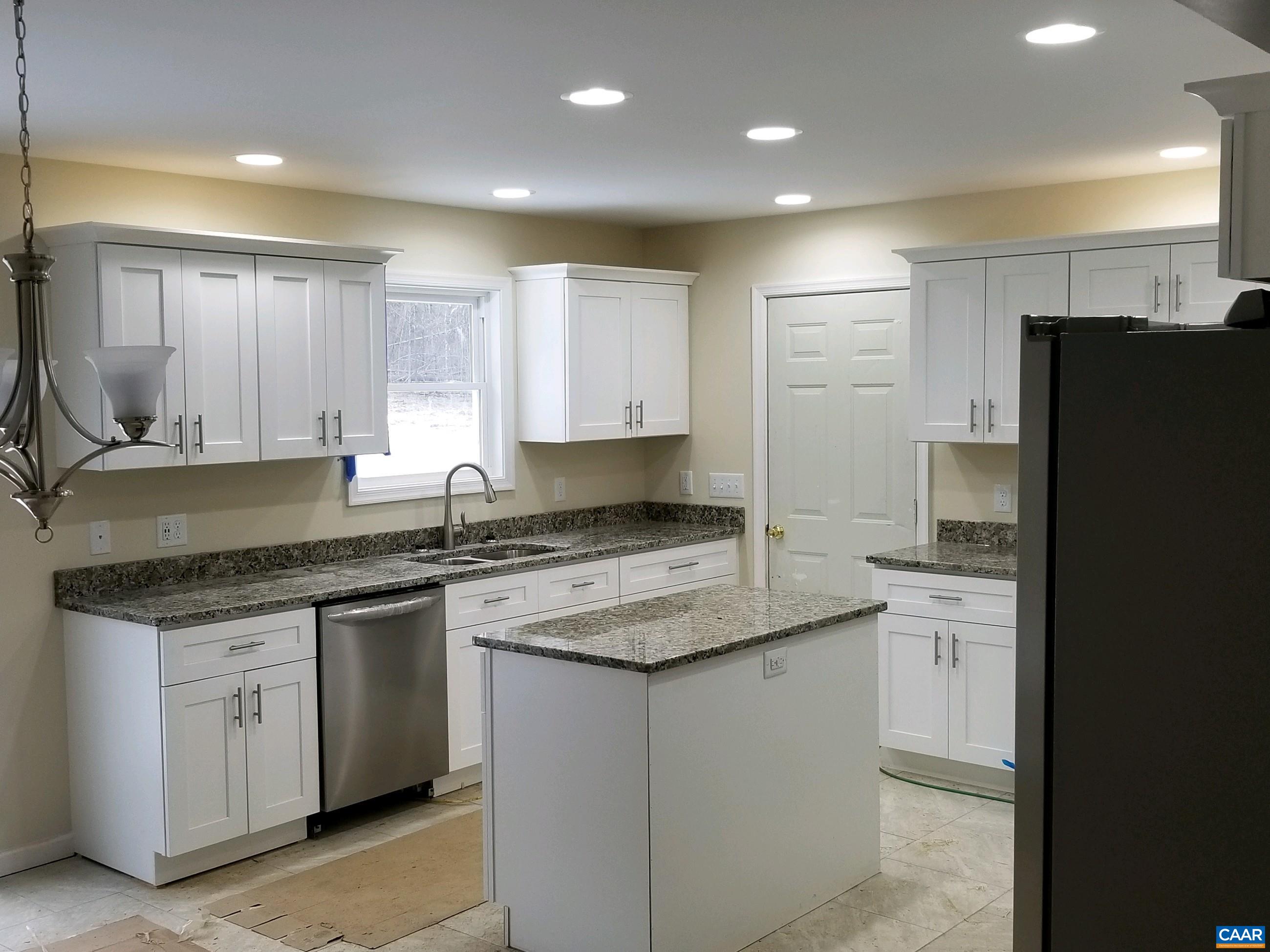 618 Chapel Road Ruckersville, VA 22968 - Photo 4 of 13 a kitchen with a sink stove and refrigerator