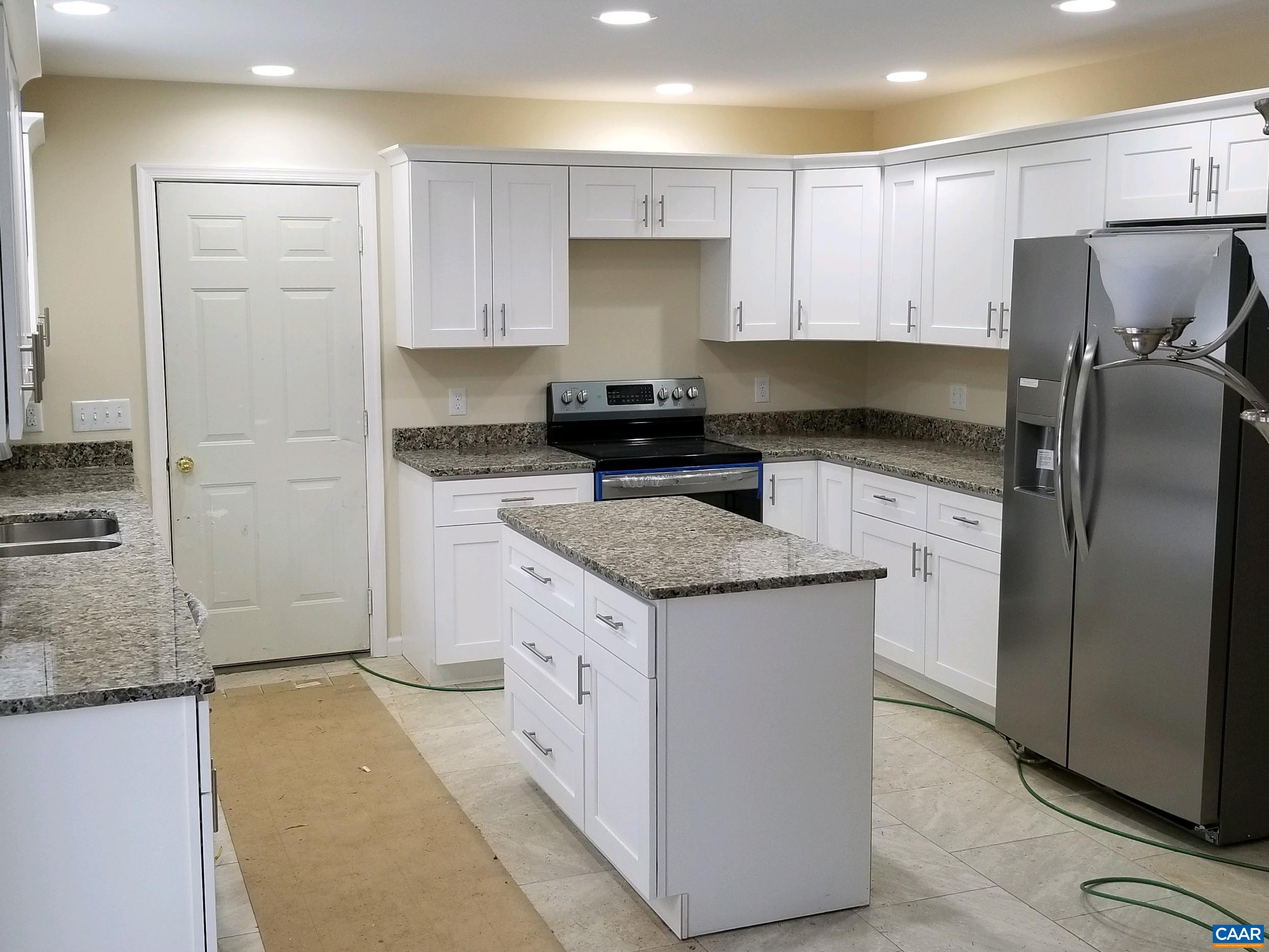 618 Chapel Road Ruckersville, VA 22968 - Photo 6 of 13 a kitchen with granite countertop a sink stove and refrigerator