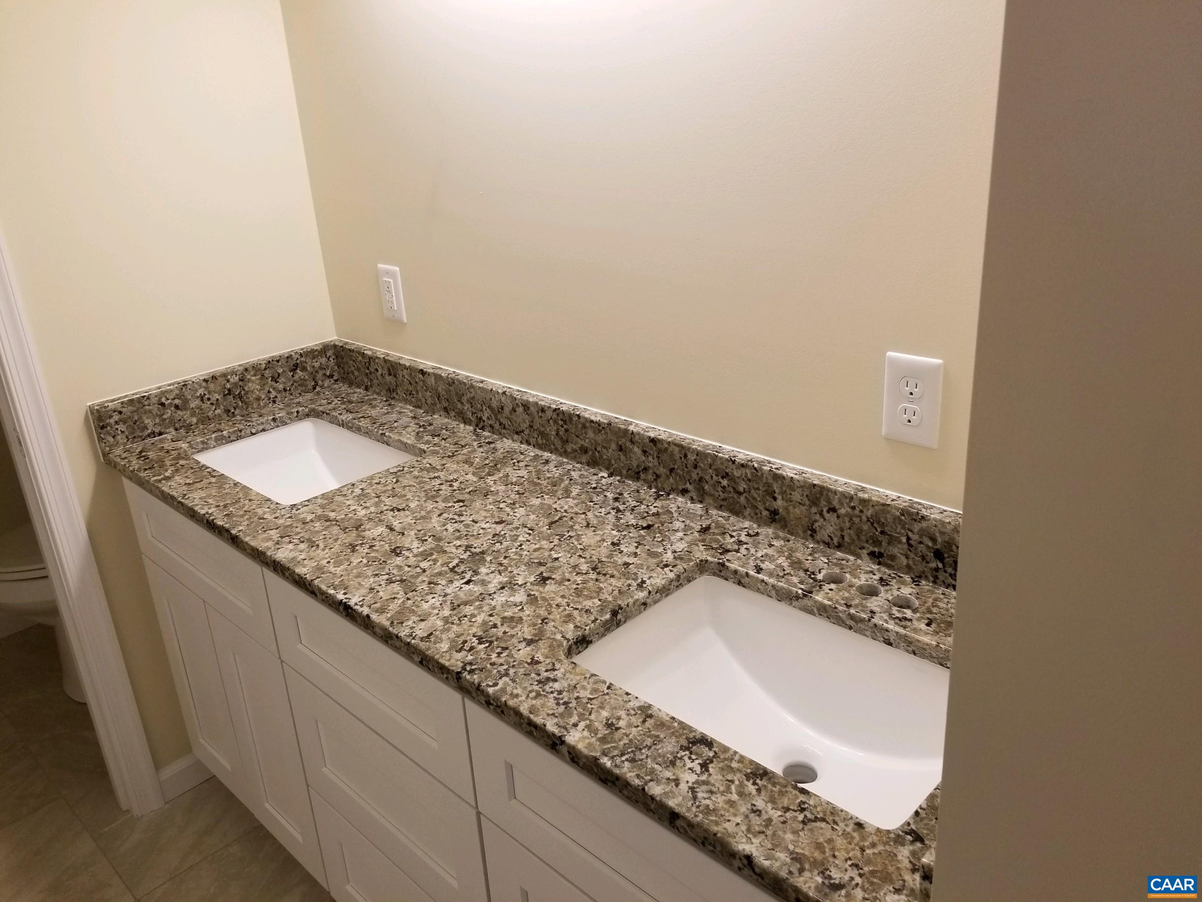 618 Chapel Road Ruckersville, VA 22968 - Photo 9 of 13 a bathroom with a granite countertop sink and a mirror