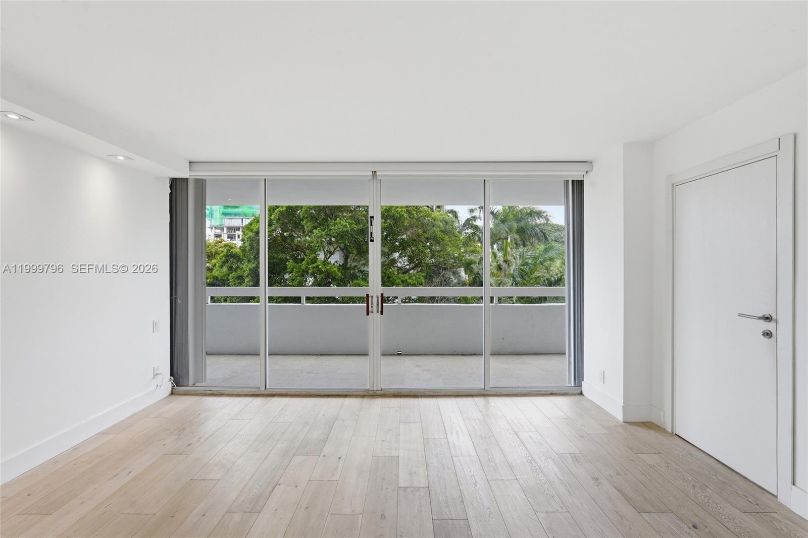 1627 Brickell Avenue, Unit 603 Miami, FL 33129 - Photo 20 of 29 a view of a room with wooden floor and outdoor view