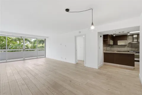 a view of a kitchen with a sink and microwave