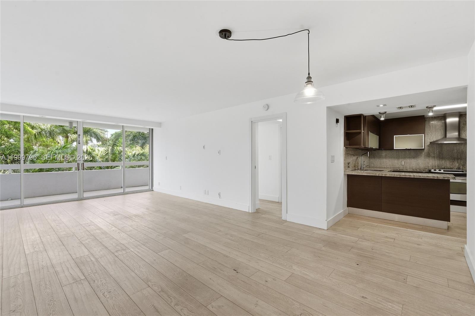 1627 Brickell Avenue, Unit 603 Miami, FL 33129 - Photo 2 of 29 a view of a kitchen with a sink and microwave