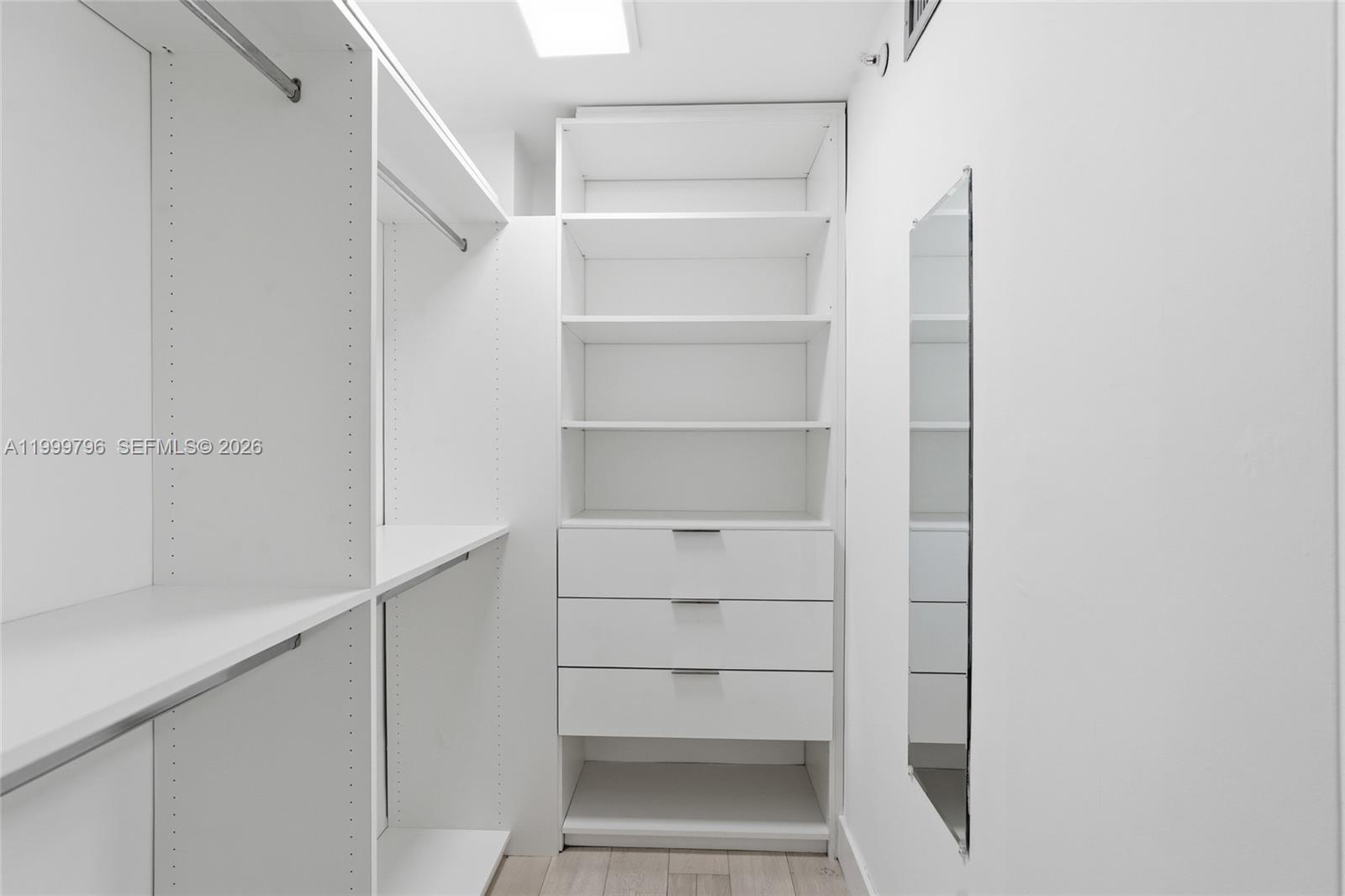 1627 Brickell Avenue, Unit 603 Miami, FL 33129 - Photo 25 of 29 a view of walk in closet with empty racks