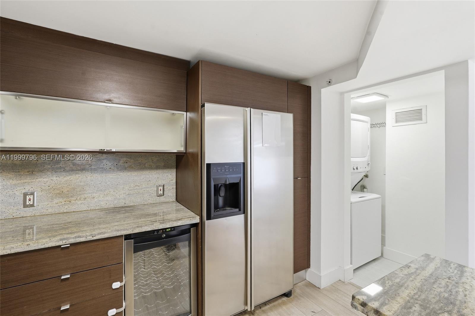 1627 Brickell Avenue, Unit 603 Miami, FL 33129 - Photo 6 of 29 a kitchen with a sink and refrigerator