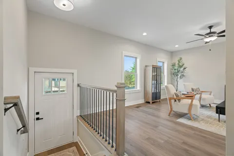 a view of a hallway with windows