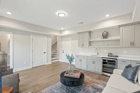 a living room with furniture and white walls