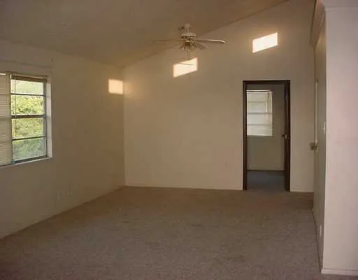 an empty room that has a window in it