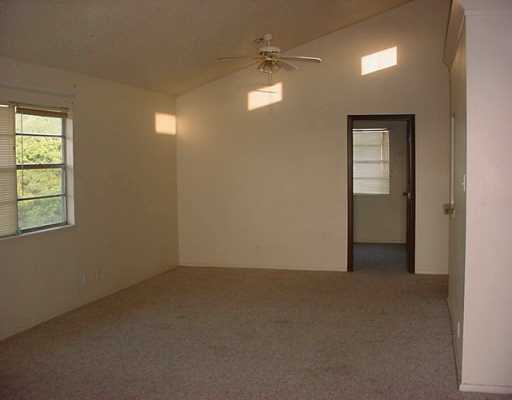 0 Easy Circle, Unit B Corpus Christi, TX 78418 - Photo 3 of 3 an empty room that has a window in it