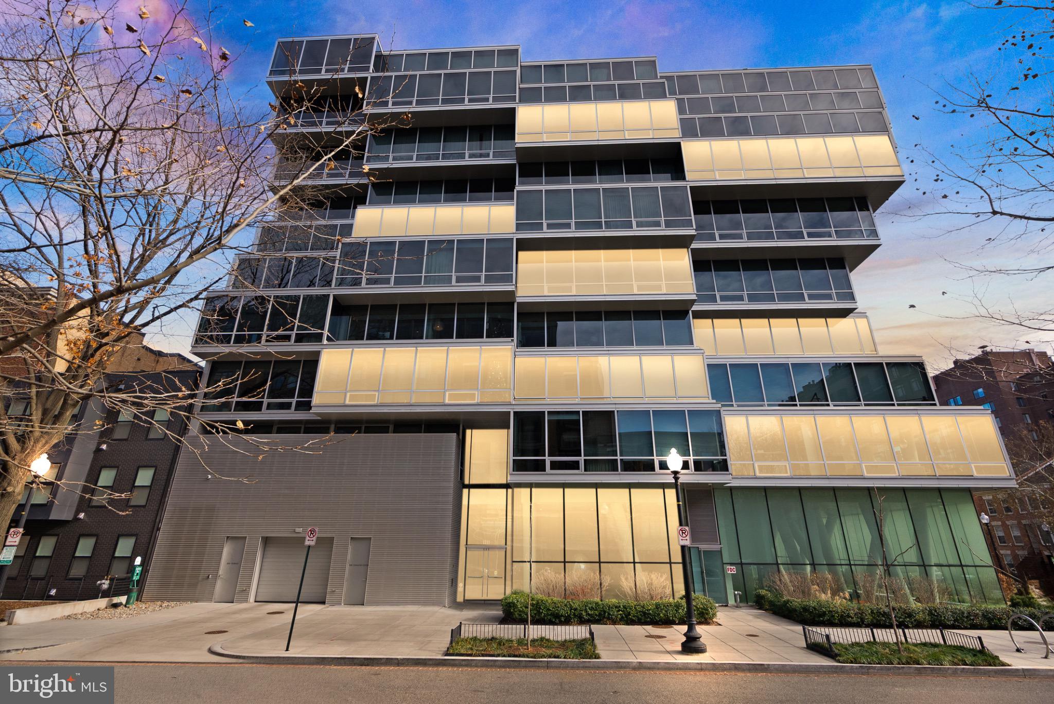 1111 24th Street Northwest, Unit 27 Washington, DC 20037 - Photo 1 of 57 a front view of a building with glass windows