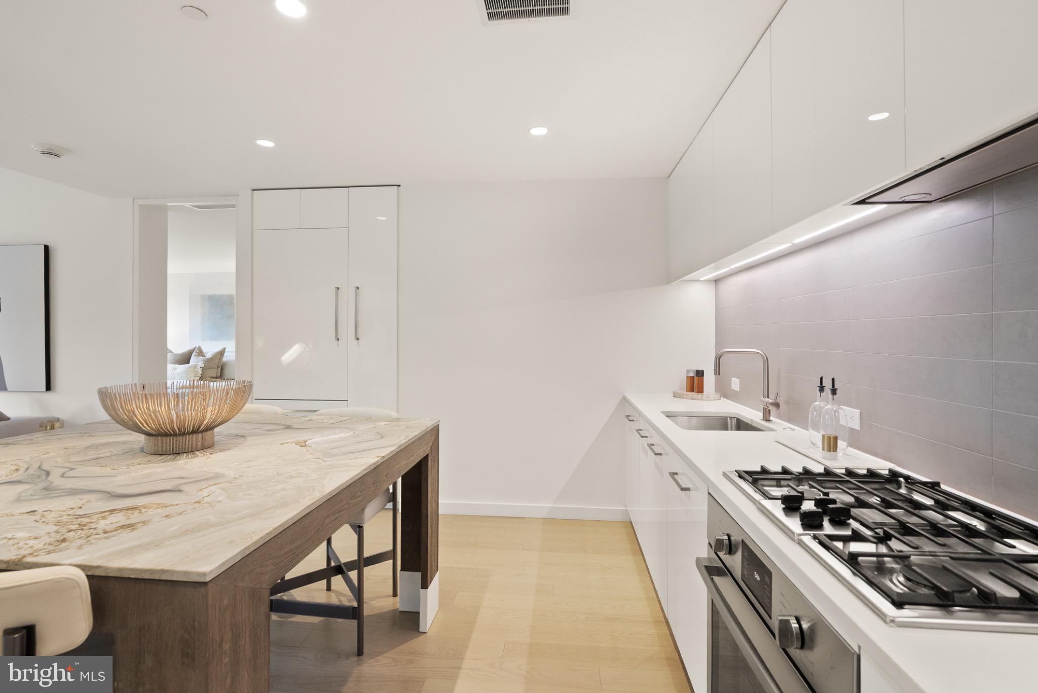 1111 24th Street Northwest, Unit 27 Washington, DC 20037 - Photo 11 of 57 a kitchen with a stove and a sink