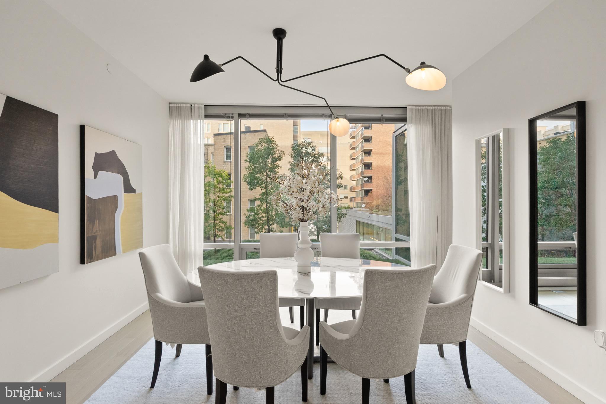 1111 24th Street Northwest, Unit 27 Washington, DC 20037 - Photo 17 of 57 a view of a dining room with furniture window and outside view