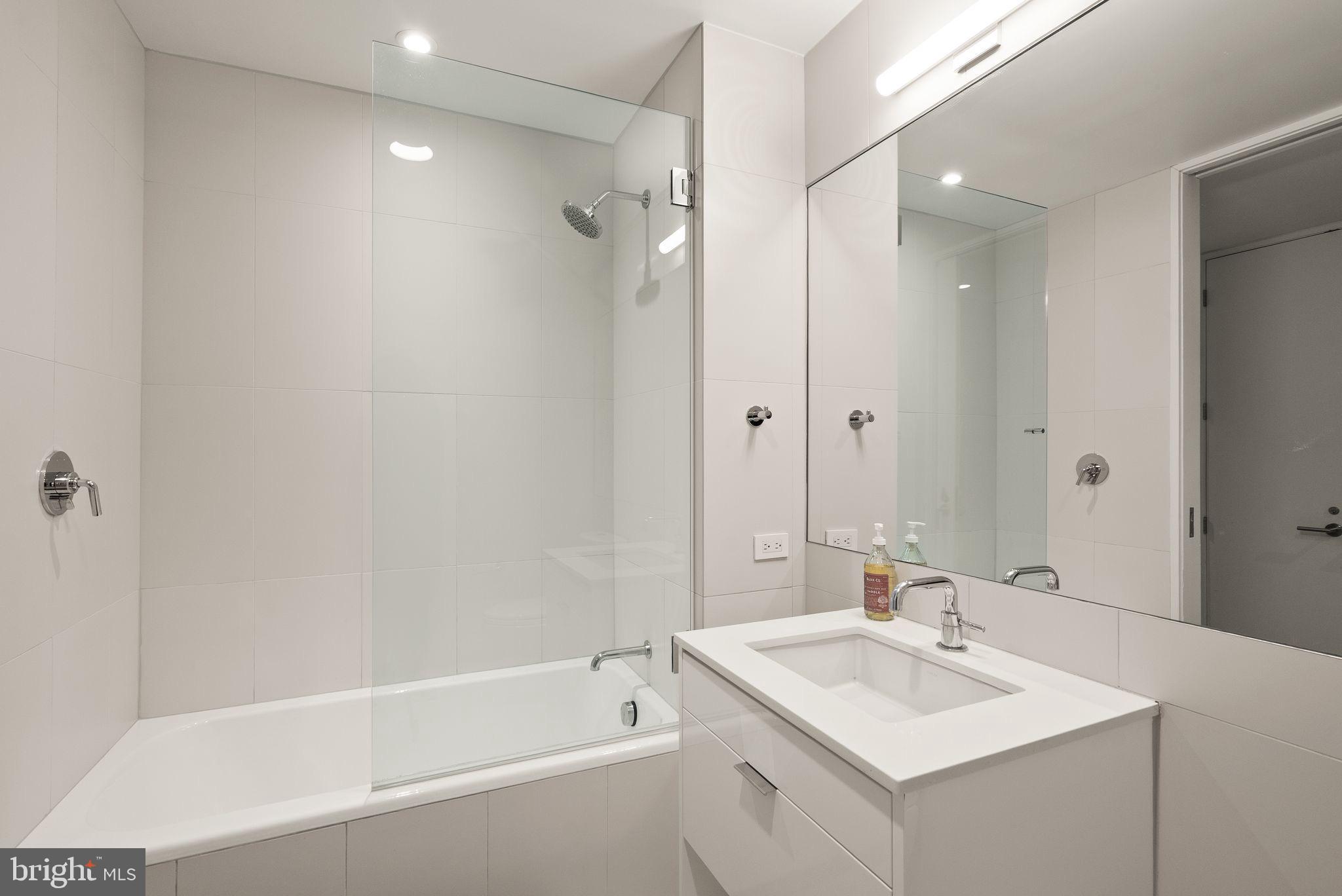 1111 24th Street Northwest, Unit 27 Washington, DC 20037 - Photo 30 of 57 a bathroom with a sink toilet and shower