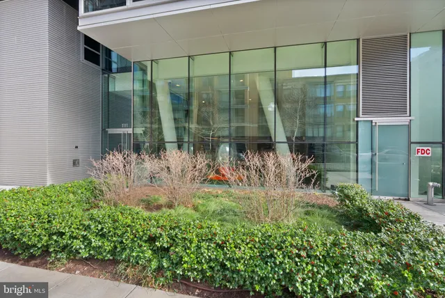 a view of a porch with a floor to ceiling window and a chair