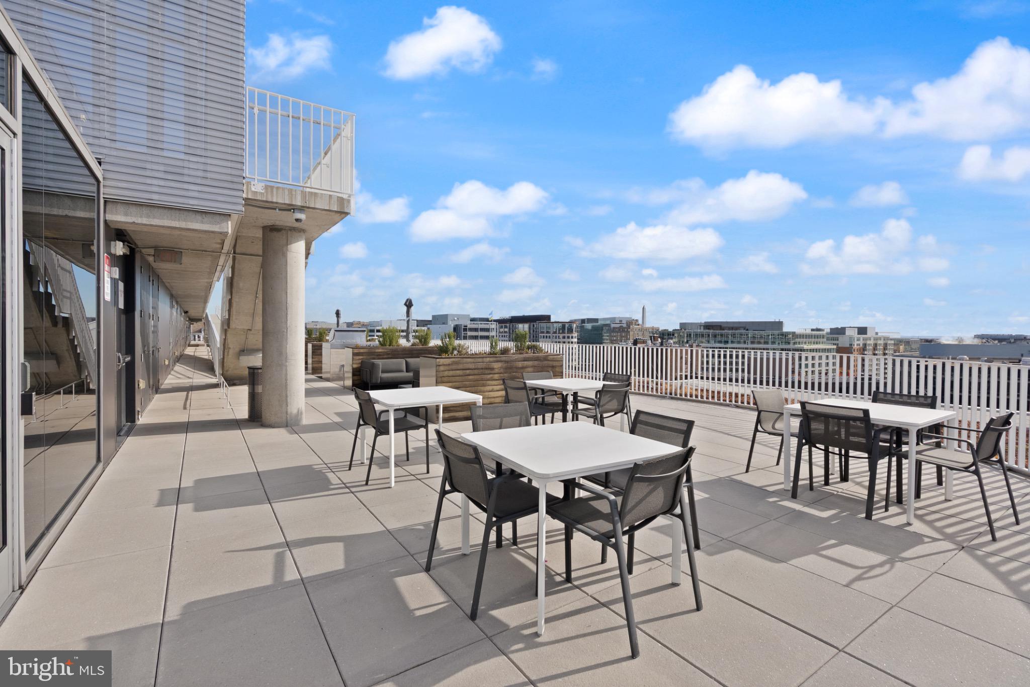 1111 24th Street Northwest, Unit 27 Washington, DC 20037 - Photo 34 of 57 a view of a terrace with dining table and chairs