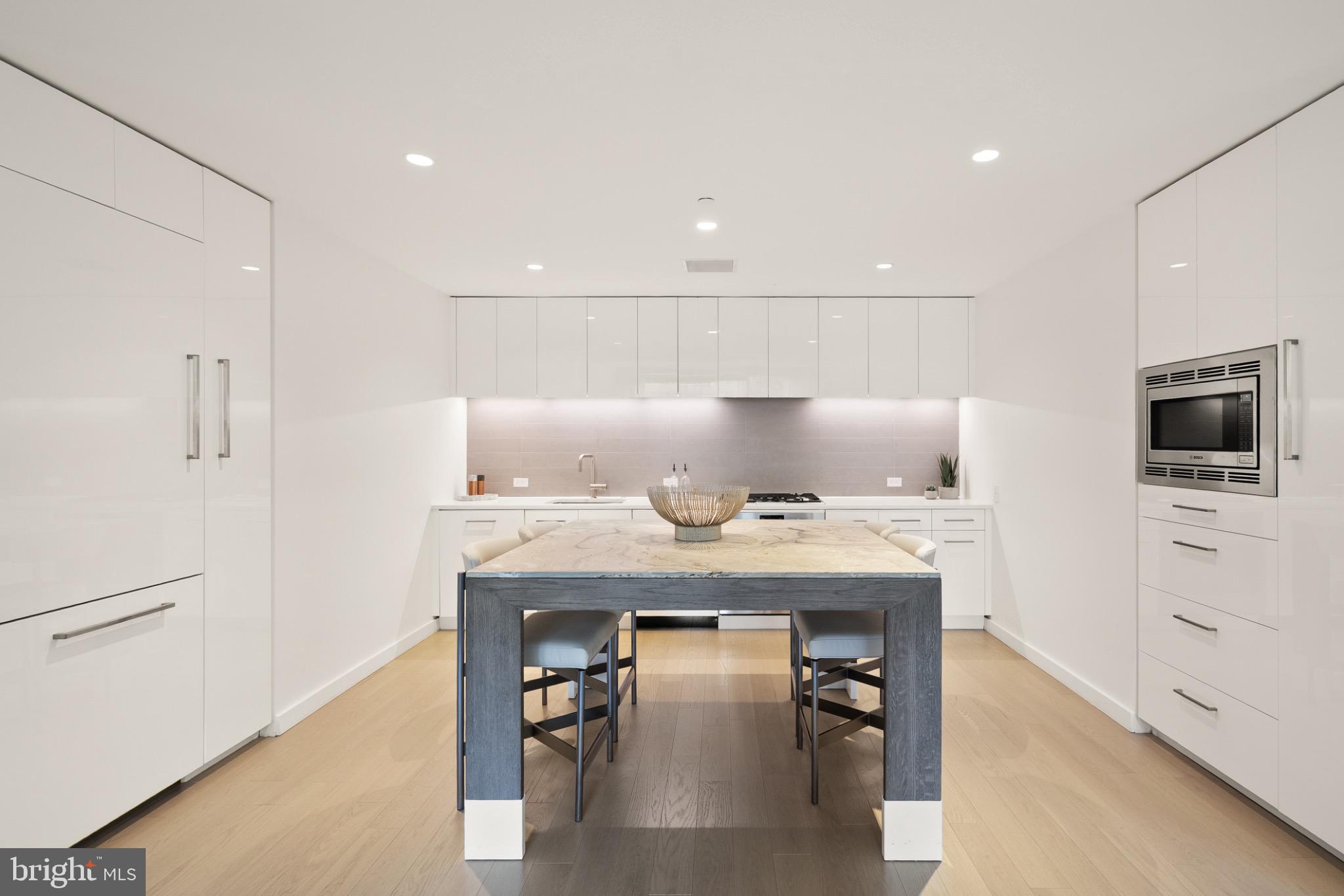 1111 24th Street Northwest, Unit 27 Washington, DC 20037 - Photo 7 of 57 Sleek modern kitchen with elegant finishes.