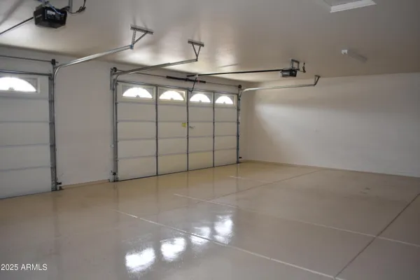 a bathroom with a granite countertop sink a large mirror and a toilet
