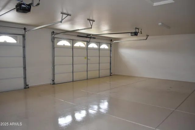 a bathroom with a granite countertop sink a large mirror and a toilet