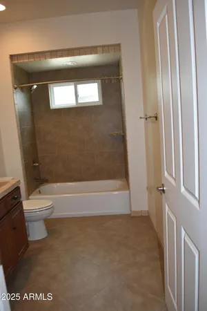a bathroom with a granite countertop sink a mirror and a