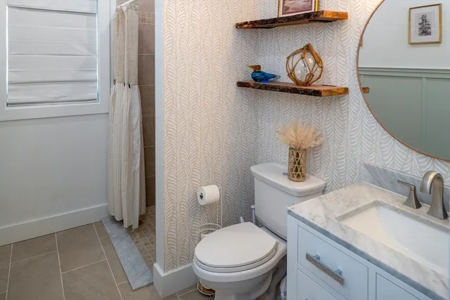 a bathroom with a toilet and a sink