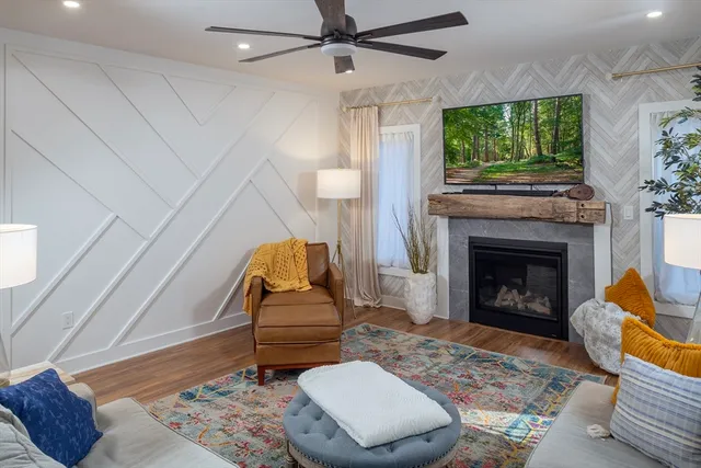 a living room with furniture and a fireplace