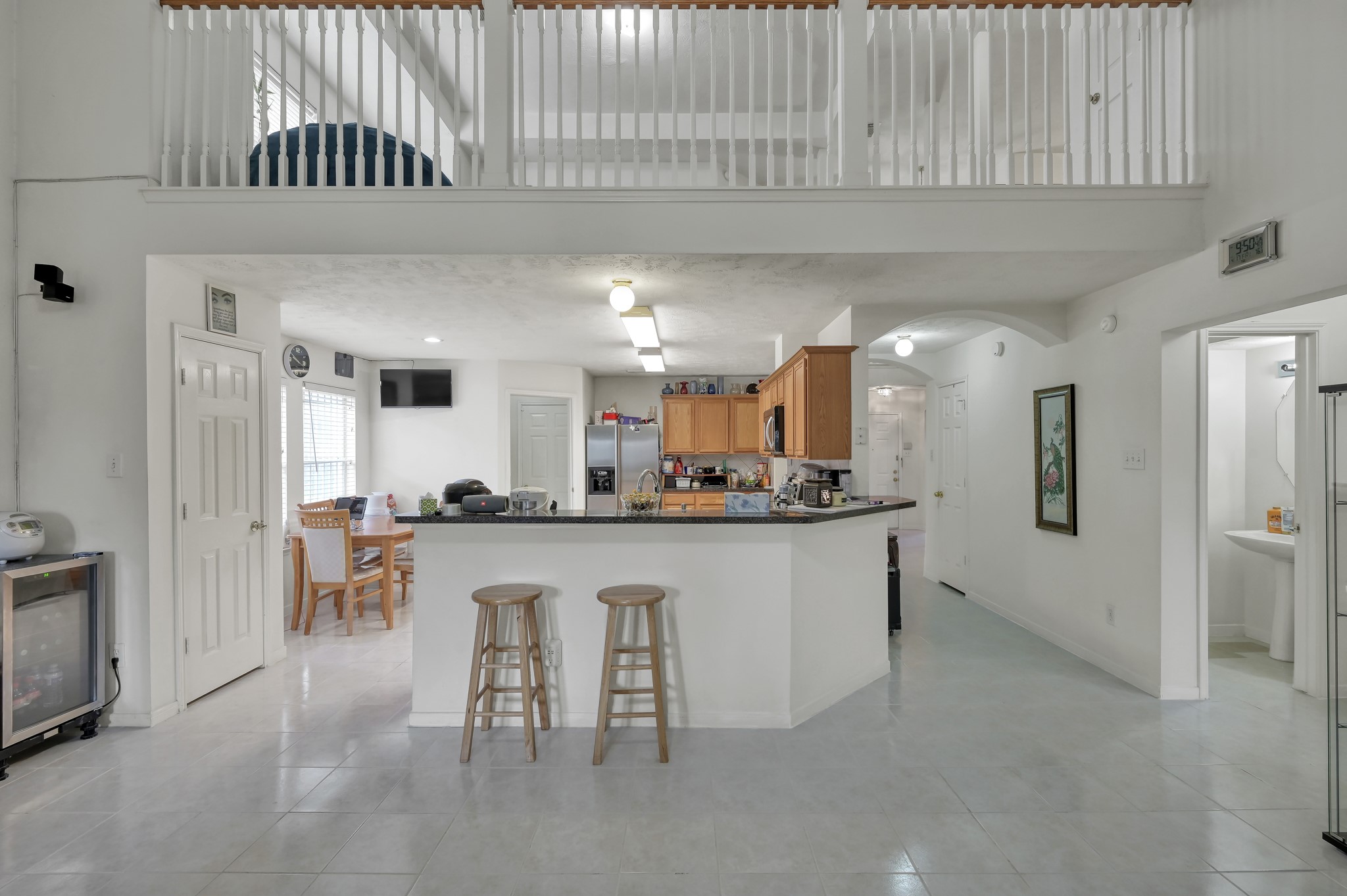 2539 Forge Creek Road Houston, TX 77067 - Photo 12 of 40 Soaring ceilings in the living room with an overlook from the upstairs game room.