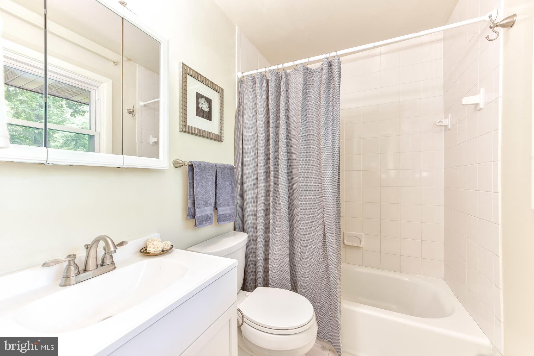 7201 Fort Hunt Road Alexandria, VA 22307 - Photo 11 of 30 a bathroom with a sink toilet and shower