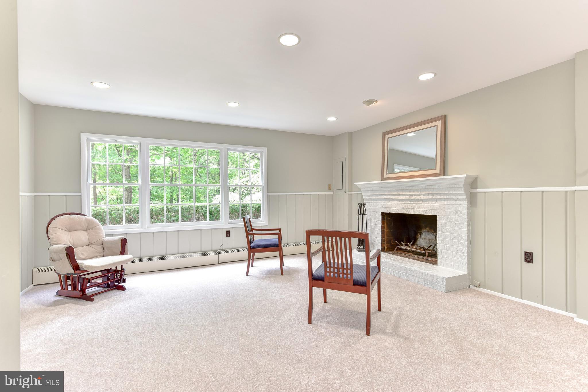 7201 Fort Hunt Road Alexandria, VA 22307 - Photo 15 of 30 a living room with furniture and a fireplace