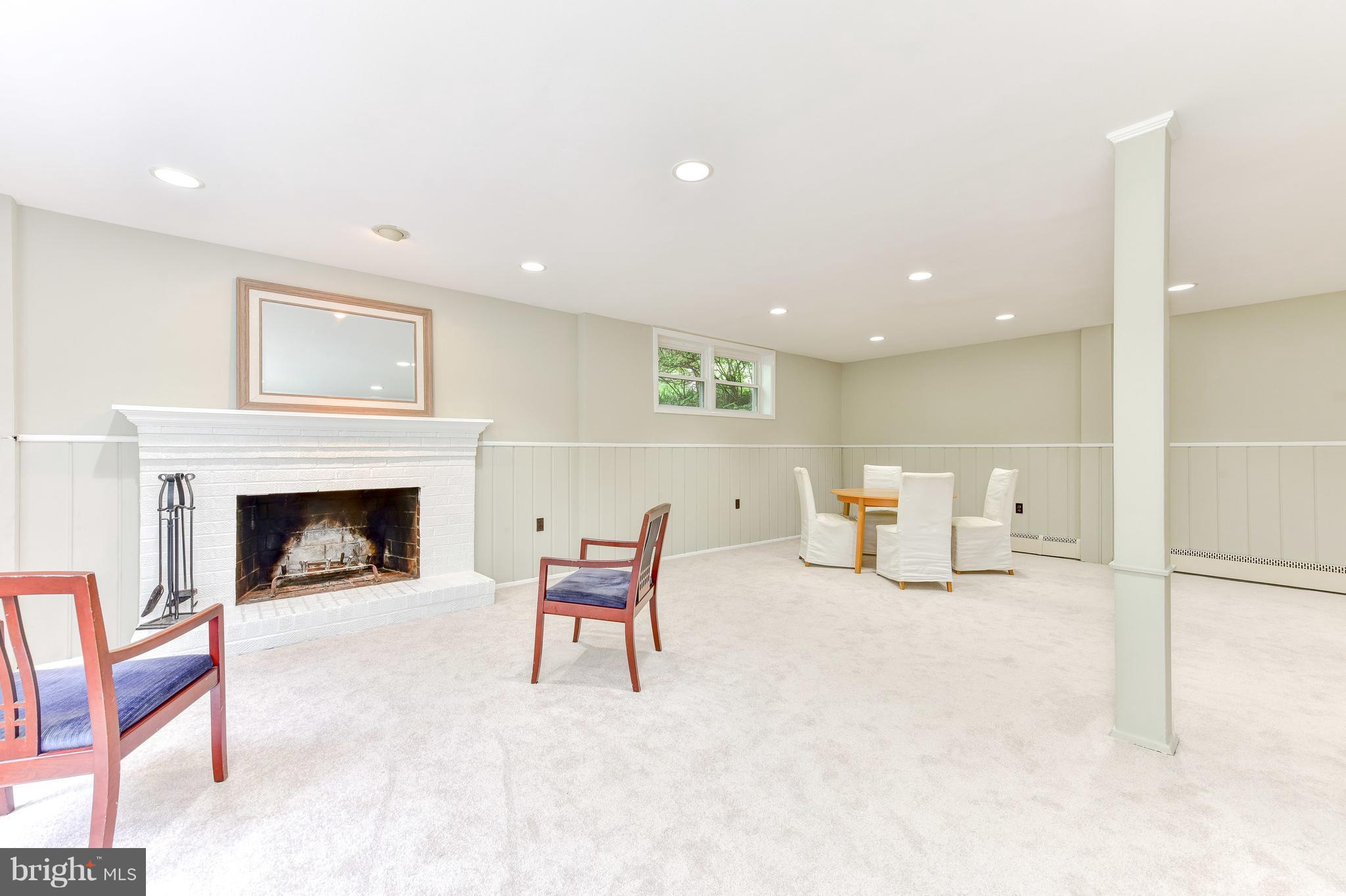 7201 Fort Hunt Road Alexandria, VA 22307 - Photo 16 of 30 a living room with furniture and a fireplace