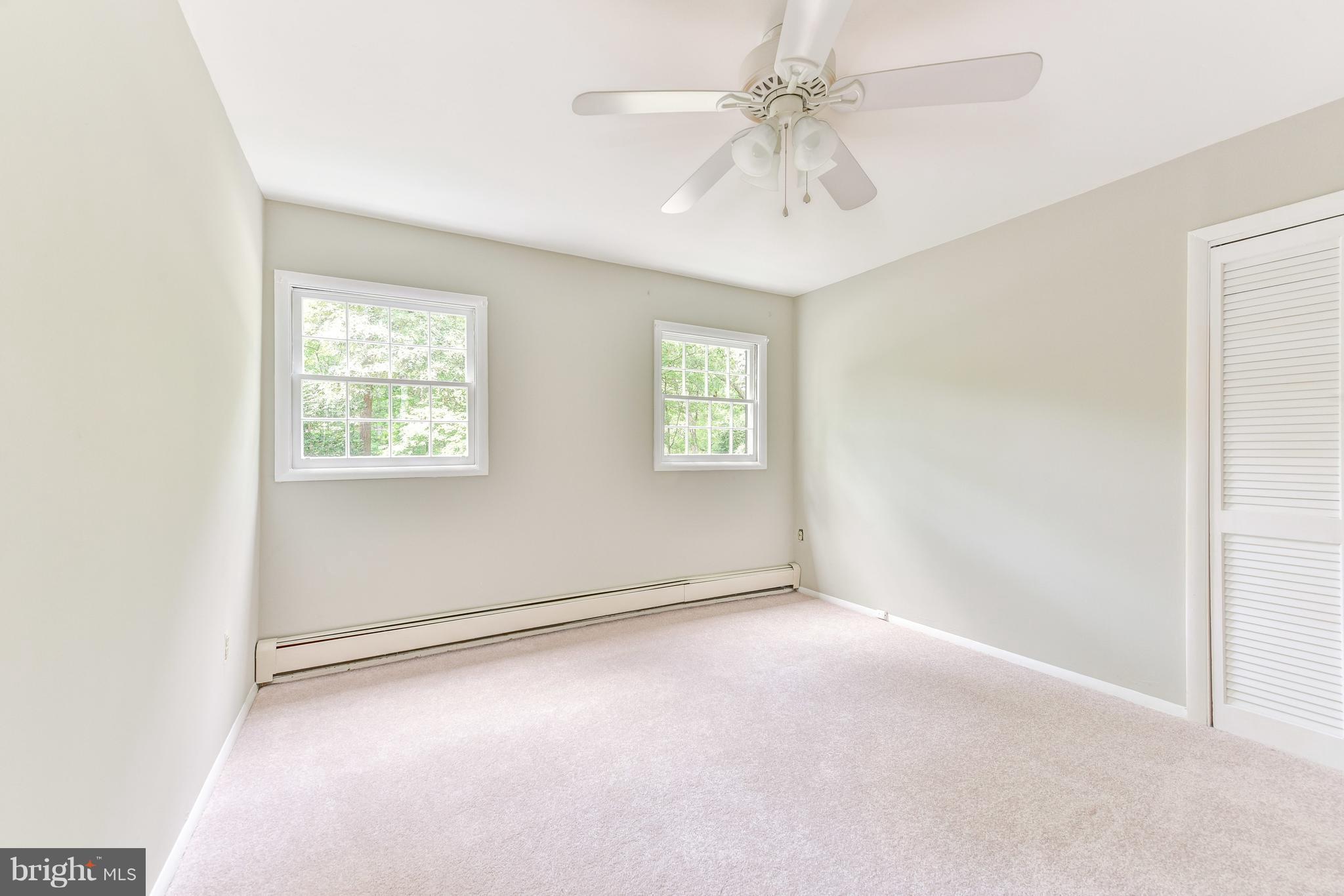 7201 Fort Hunt Road Alexandria, VA 22307 - Photo 17 of 30 an empty room with windows and fan