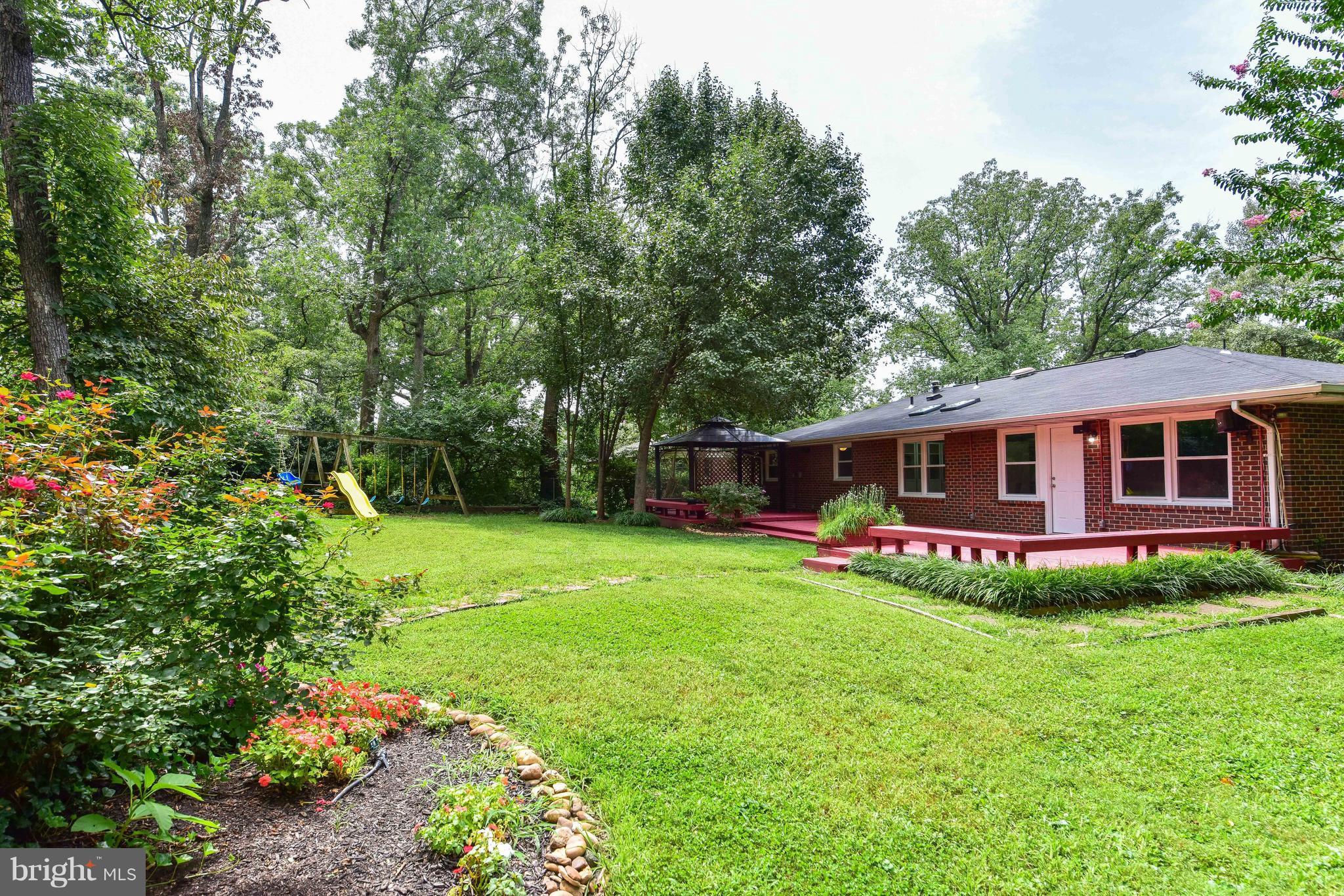 7201 Fort Hunt Road Alexandria, VA 22307 - Photo 24 of 30 a view of a house with a backyard