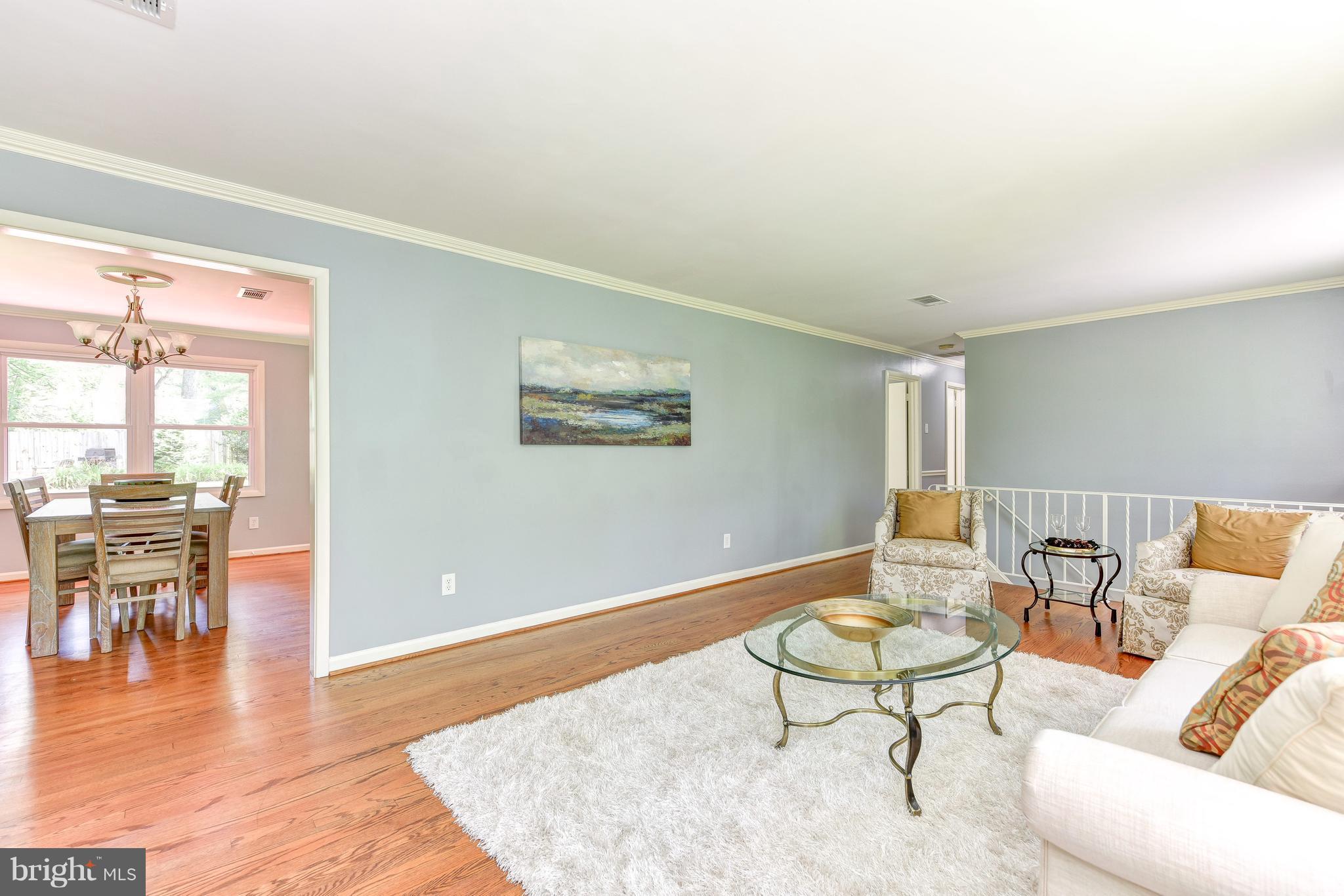 7201 Fort Hunt Road Alexandria, VA 22307 - Photo 8 of 30 a living room with furniture a dining table and a large window