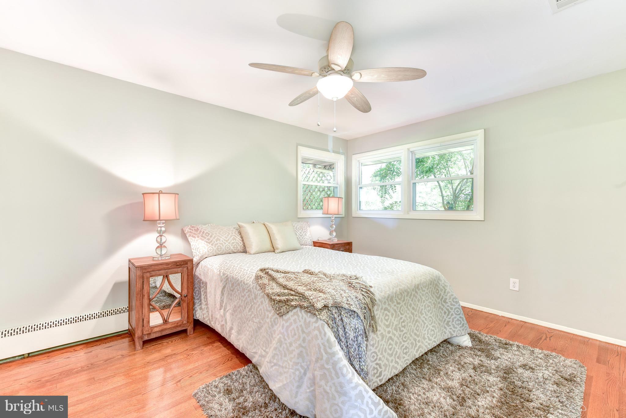 7201 Fort Hunt Road Alexandria, VA 22307 - Photo 9 of 30 a bedroom with a bed and a chandelier