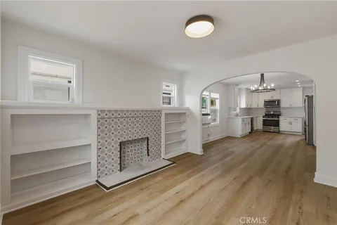 a view of a kitchen with a dishwasher cabinets and a fireplace