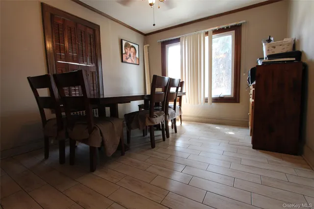 a view of a dining room with furniture and window