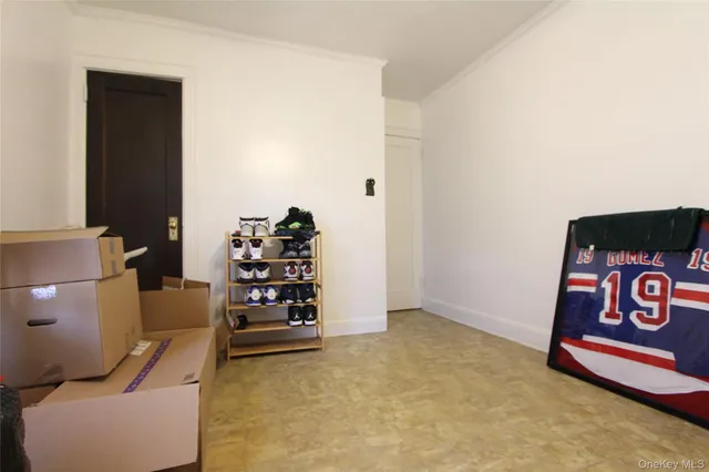 a view of a livingroom with shelves