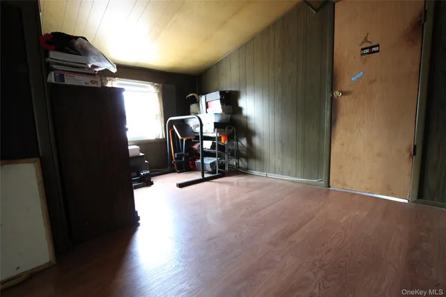 a view of a livingroom with furniture and a way to kitchen