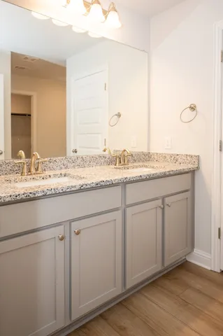 a white toilet sitting next to a shower