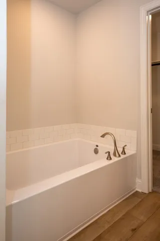 a bathroom with a glass shower door